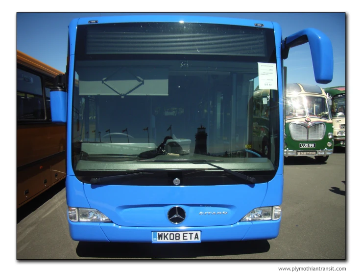 this is the front view of a blue bus