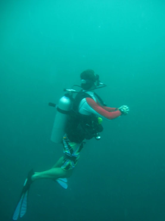 a man is swimming with two backpacks