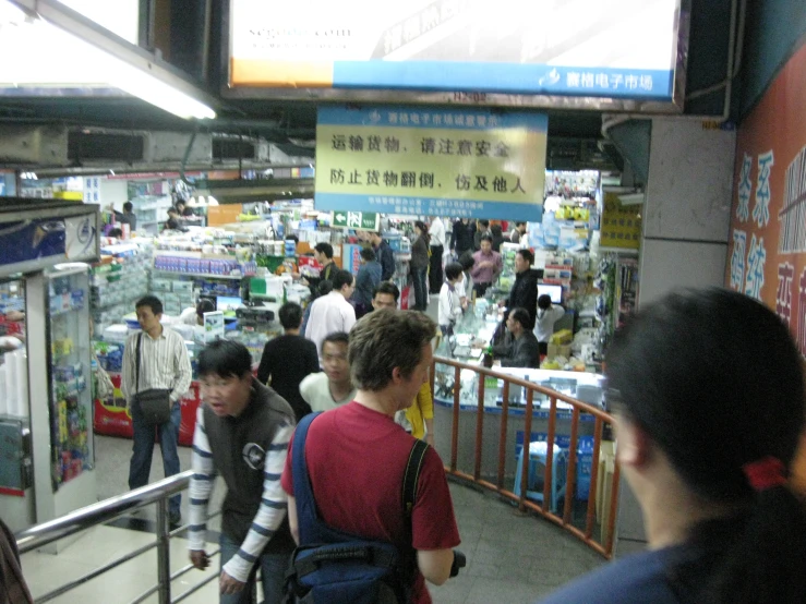 there is a large crowd inside the store