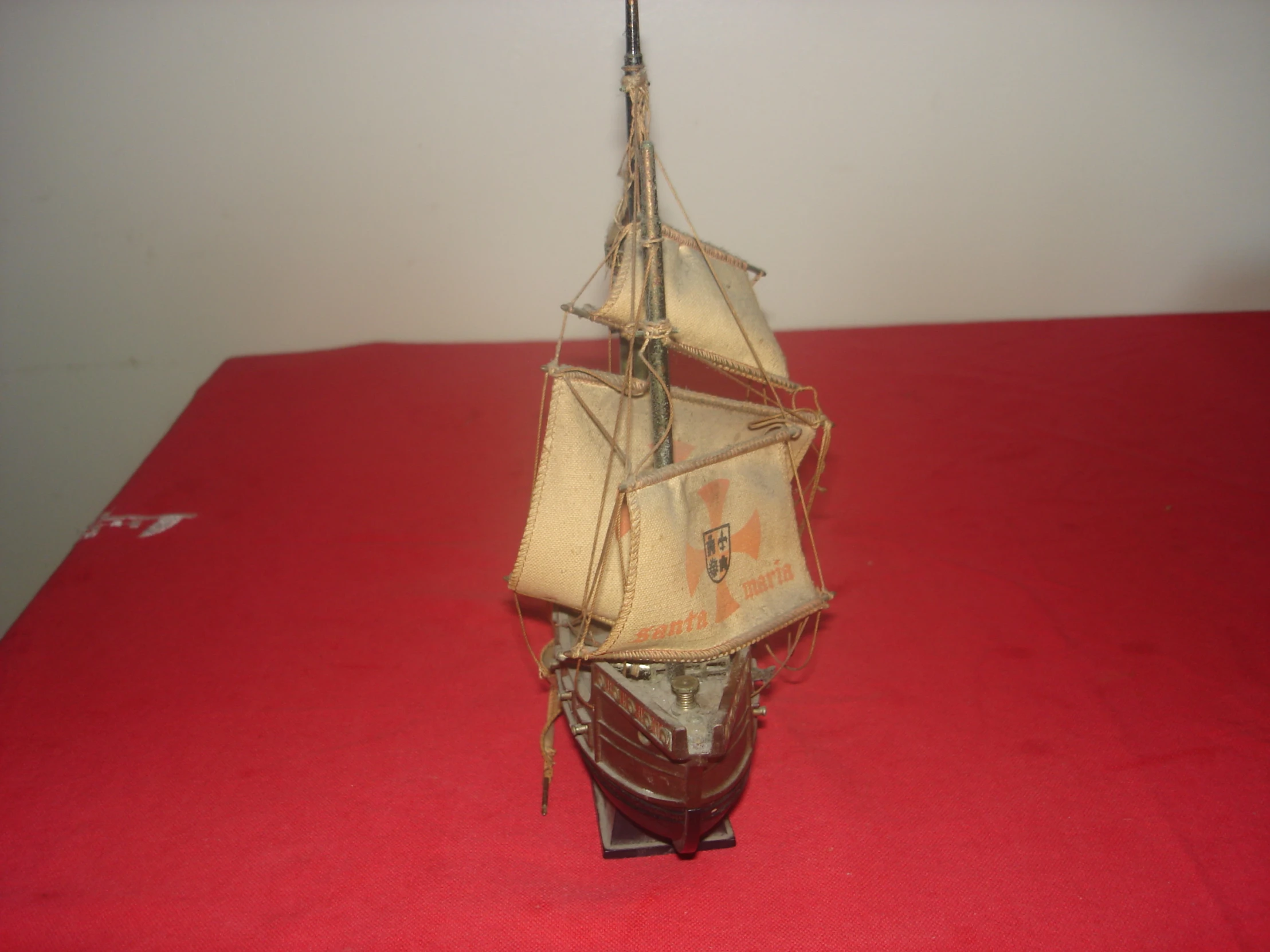 a small ship made of a doll and paper