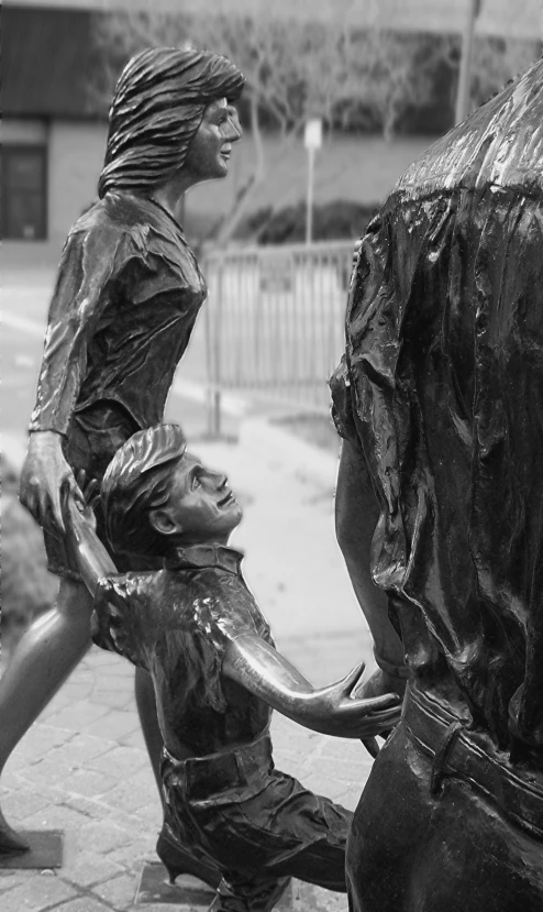 a black and white po of a statue of two men