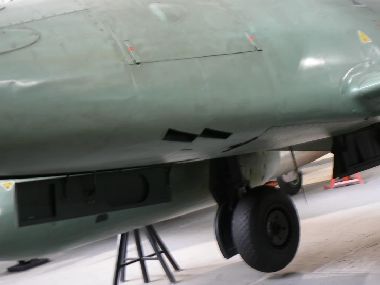 the front end of an old aircraft with two wheels