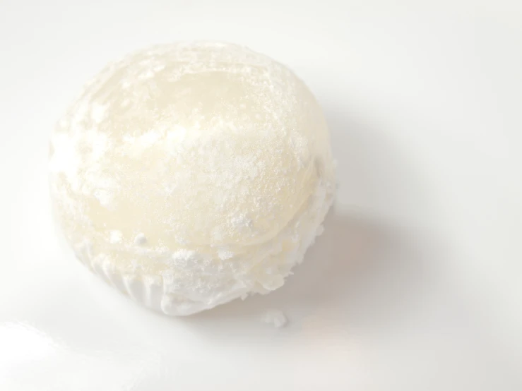 a round ball of cake batter on a white surface