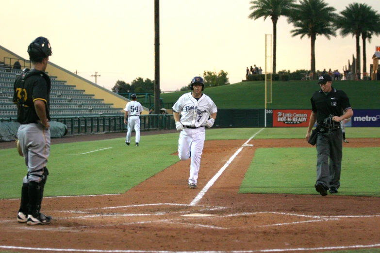 a baseball player running up to home plate