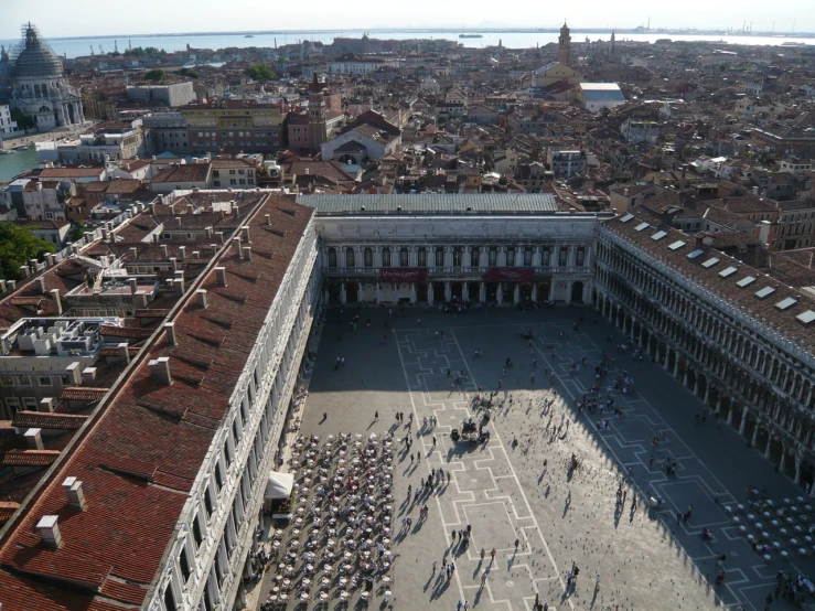 an aerial view of the plaza in a city with many people around it