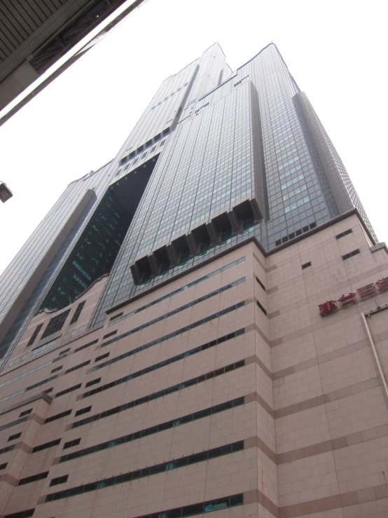 a large tall building sitting next to a metal gate