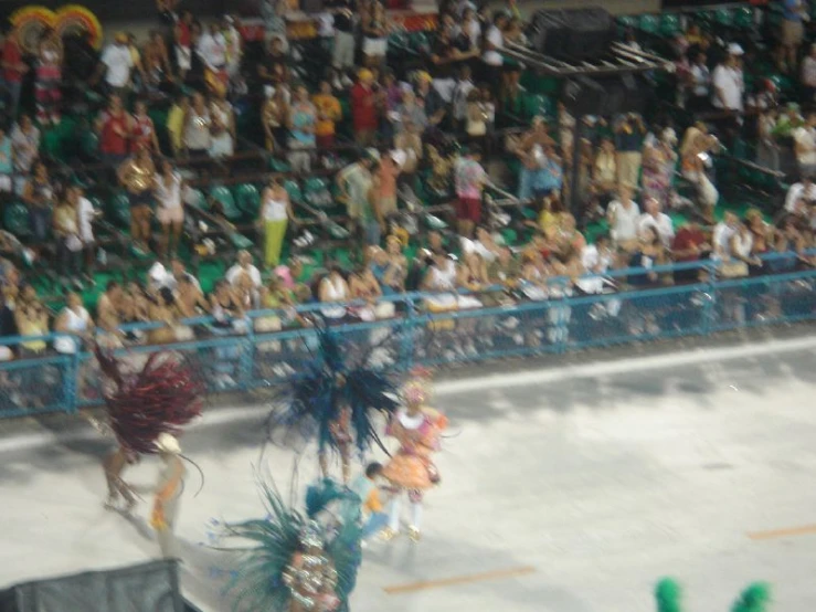 the dancers are performing for a large crowd