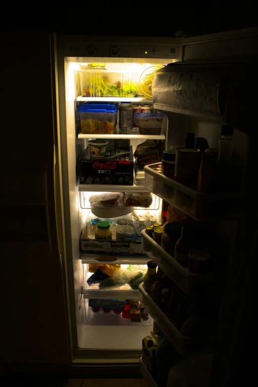 an open refrigerator filled with food and drinks
