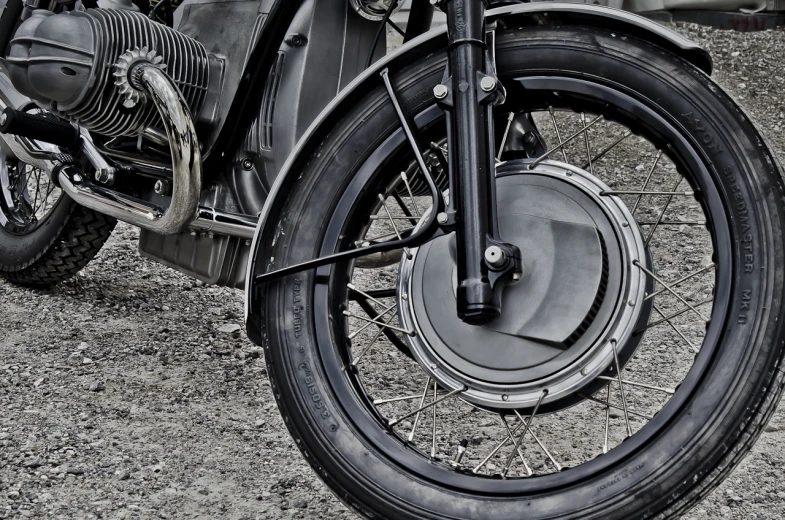 an old fashioned motorcycle is parked in a field