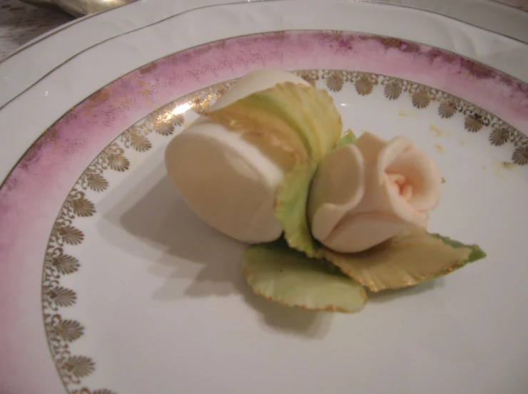 two pieces of fruit on a plate with flowers