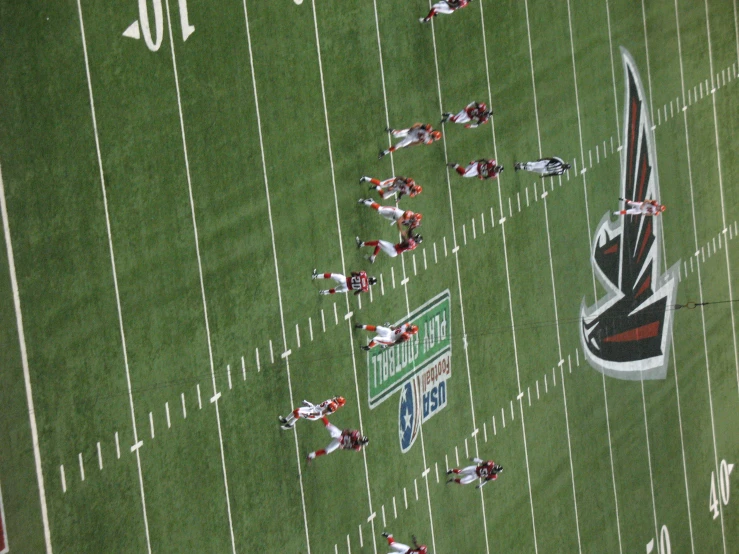 a football team running on the field