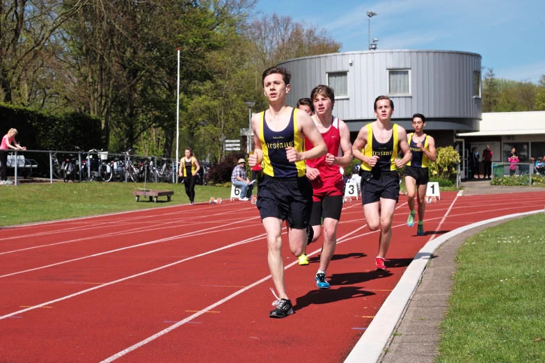 the two men are running on the track