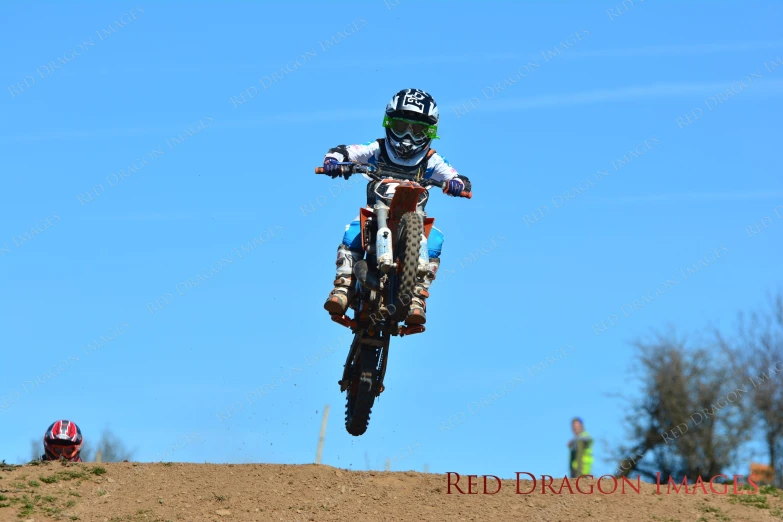 a person on a dirt bike doing a trick in the air