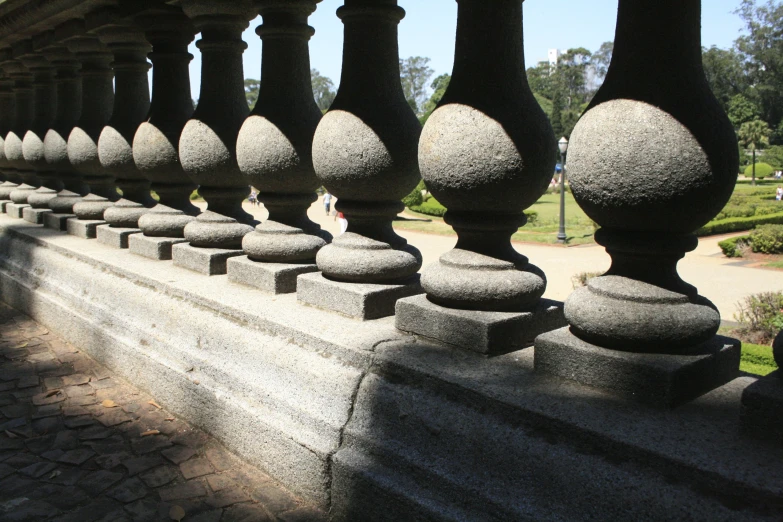 the black railing in the middle of a walkway