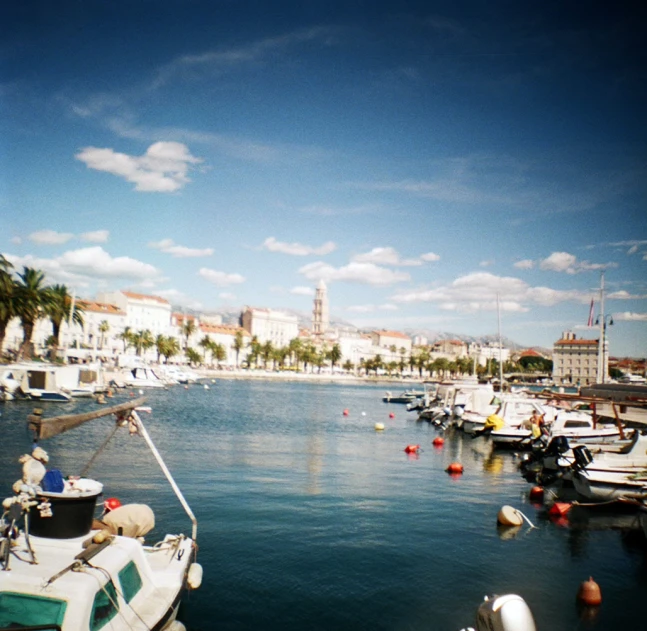 a marina has boats and a boat in it