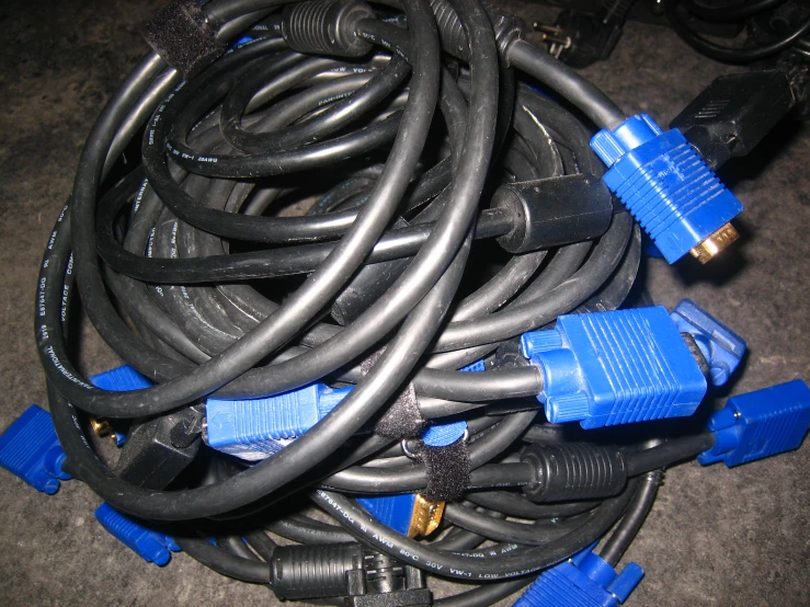 various cables and wires laying on a carpet