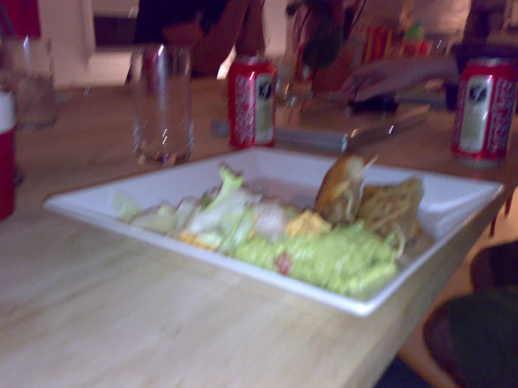 there is food on the table next to the drinks
