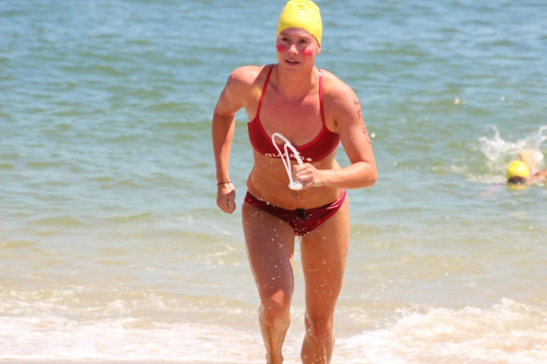 a woman in a bathing suit on a beach