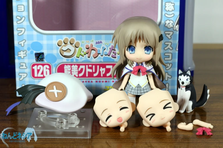 an anime doll with two little dolls near a cat and dog