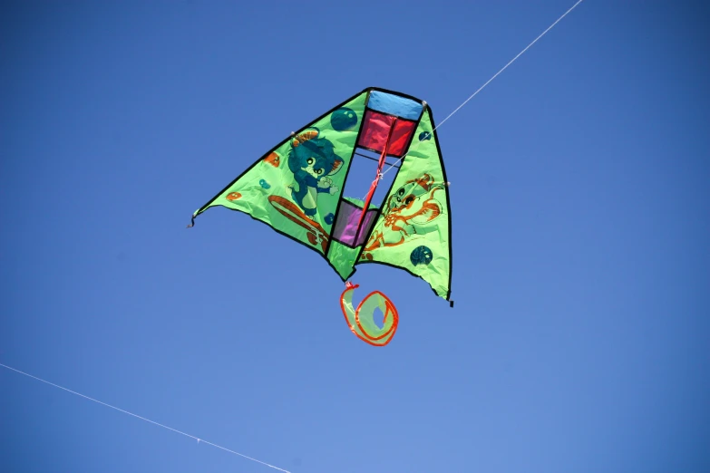 a kite flying high in the blue sky