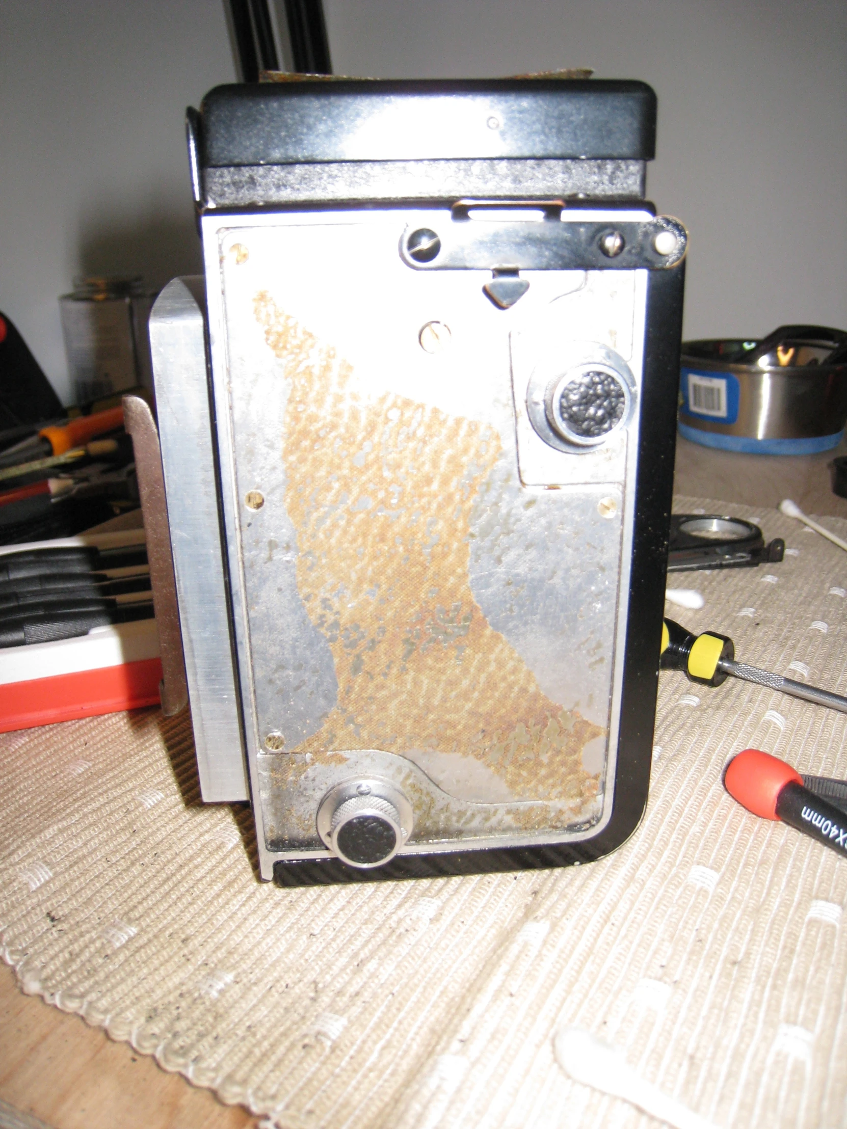 a broken and dirty old oven sitting on a counter