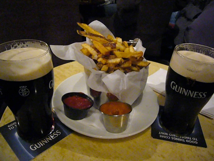 a bunch of food and drinks on a table