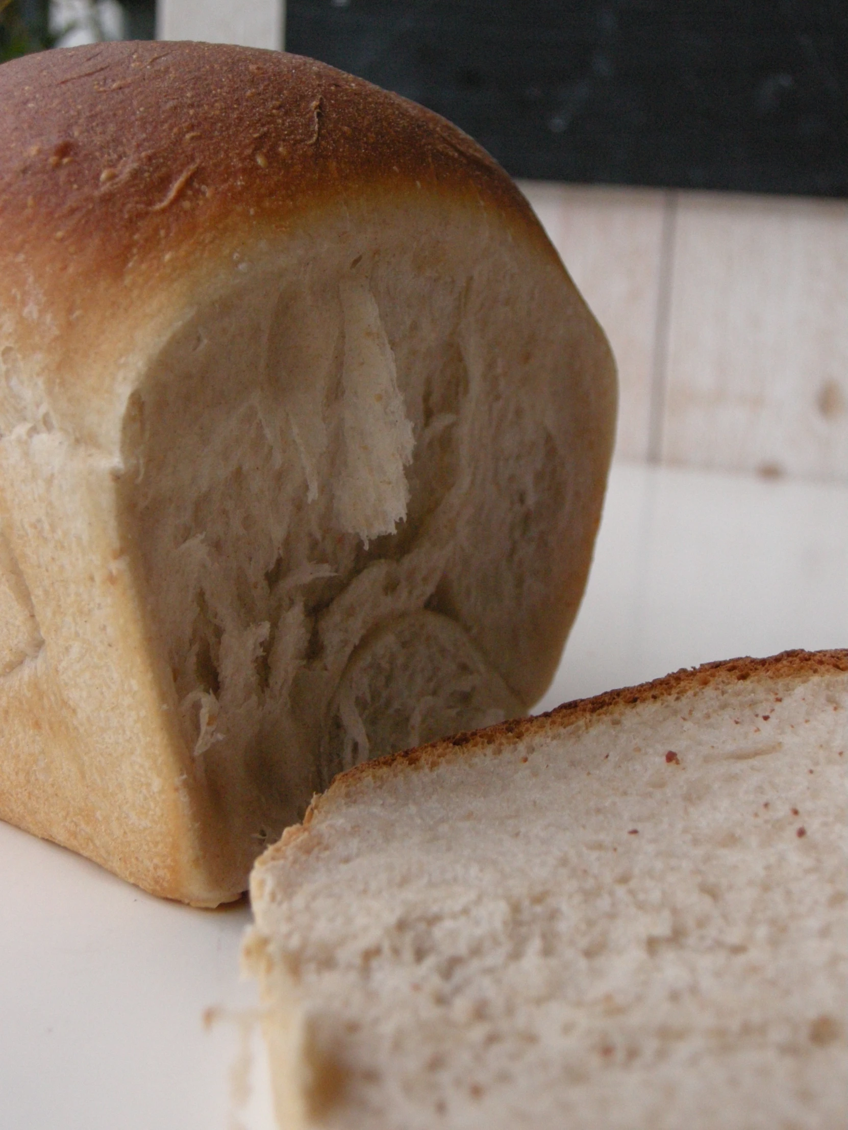 a loaf of bread on a table near a knife