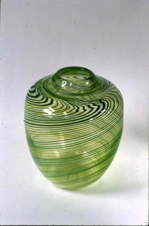 a decorative bowl with wavy lines of light green