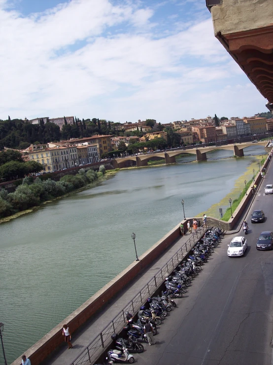 a highway going over the bridge with several cars on it