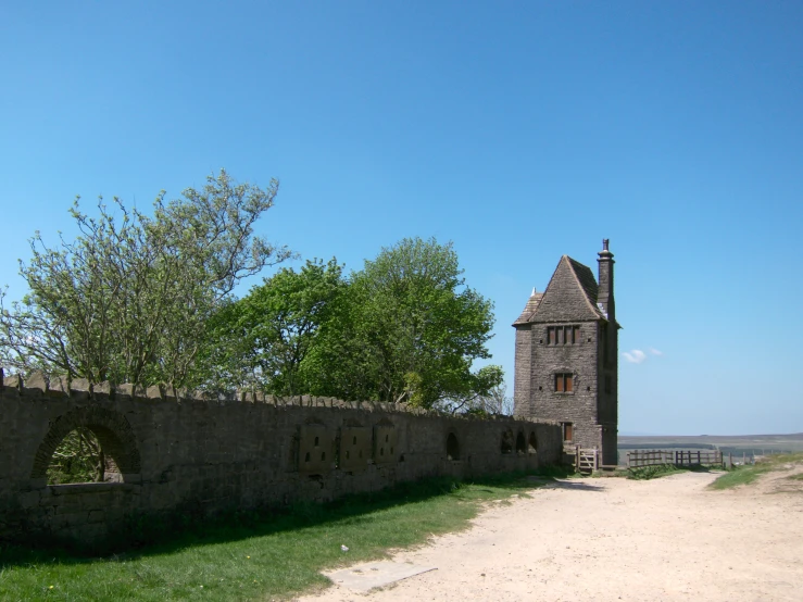 a large stone tower that is sitting on a field