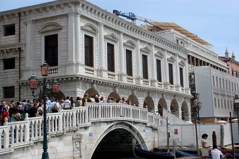 a bridge over the water that has people on it