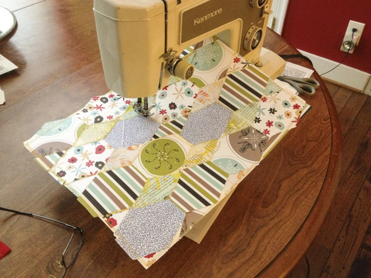 an old sewing machine on a round table