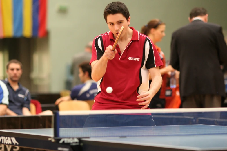 a man is hitting a ball with a racket