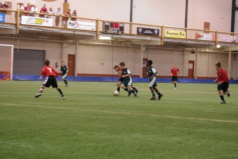 a group of young men kicking around a soccer ball