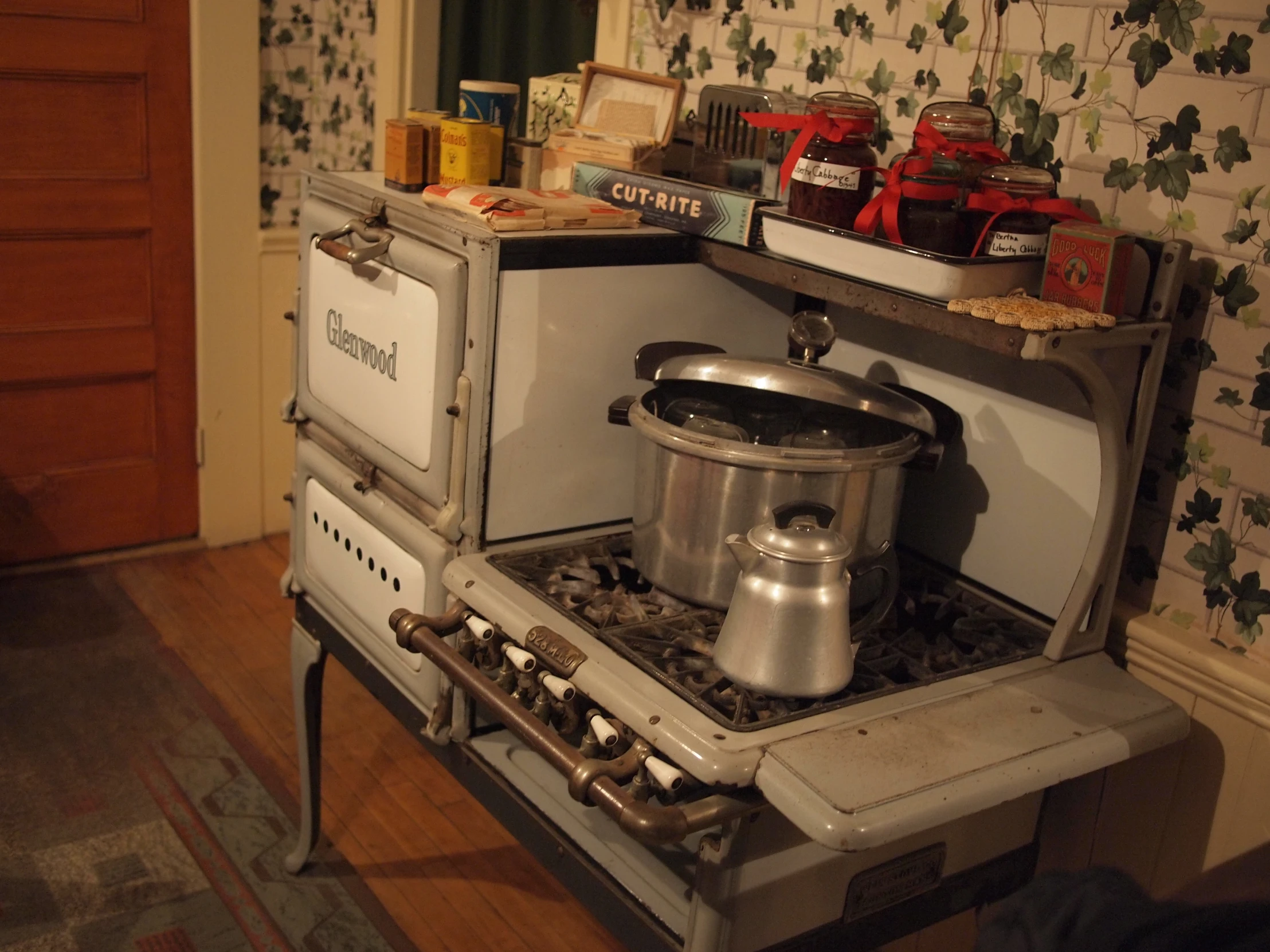 an old gas stove sitting in the middle of a room