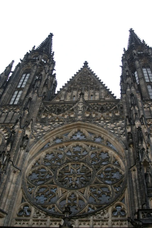 a church with a gothic style arch with stained glass windows