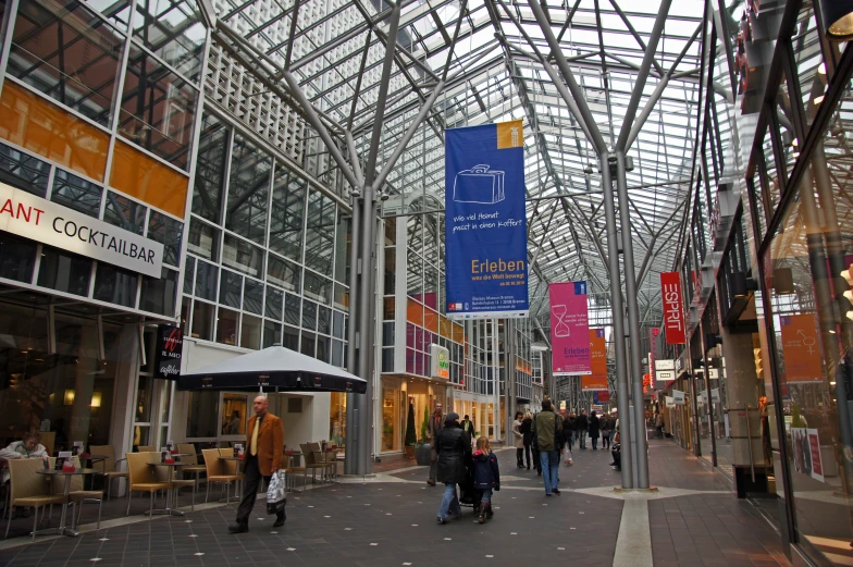 a building with several columns and tables on each floor