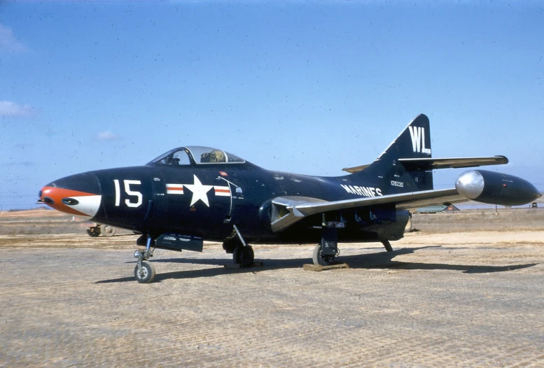 an old military airplane is parked on the tarmac