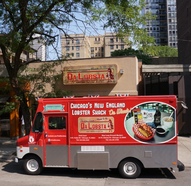 an ice cream truck parked in front of a business