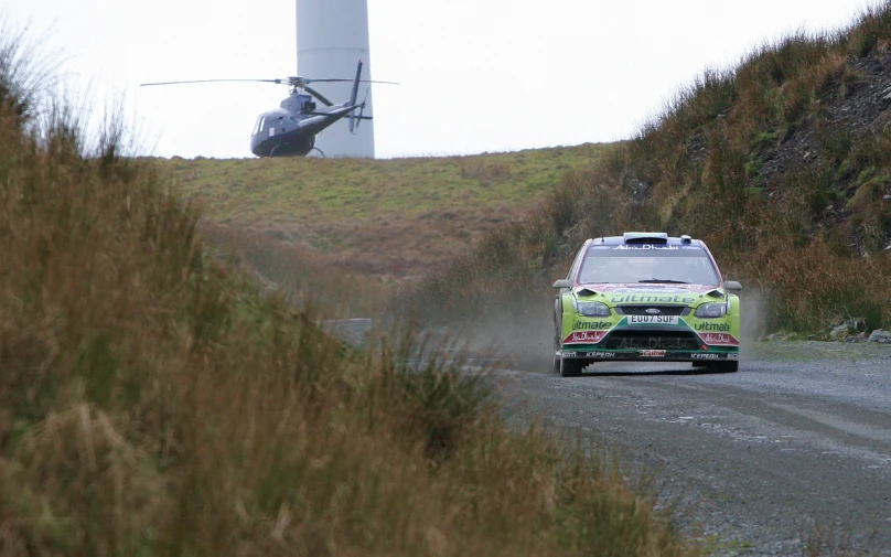 the car has been driven down a dirt road