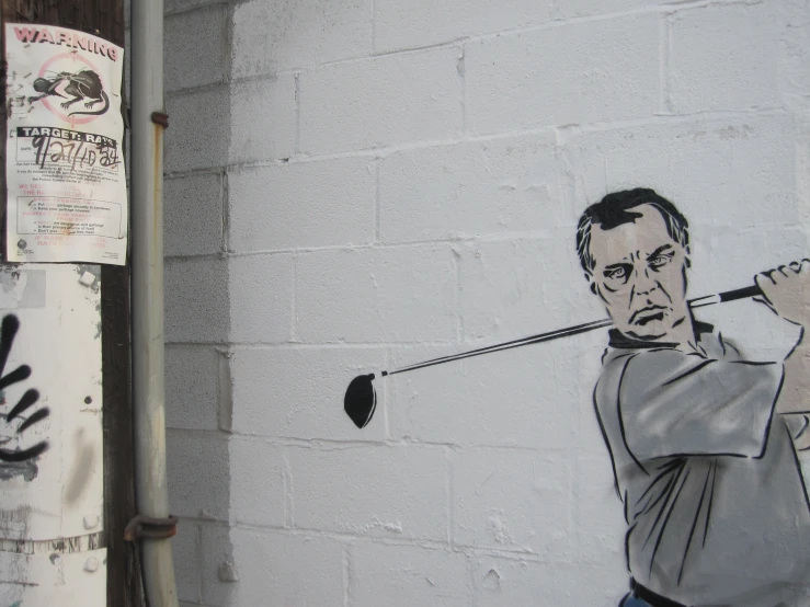 a drawing of a man playing golf on a wall