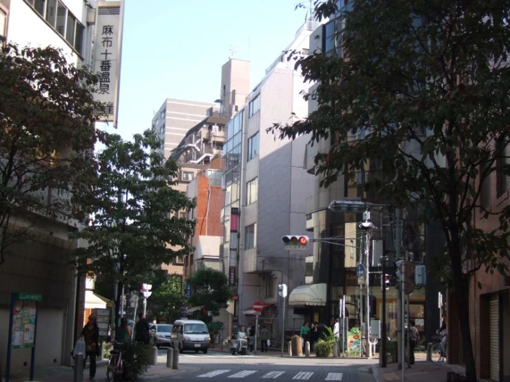 an empty street with some trees in the foreground