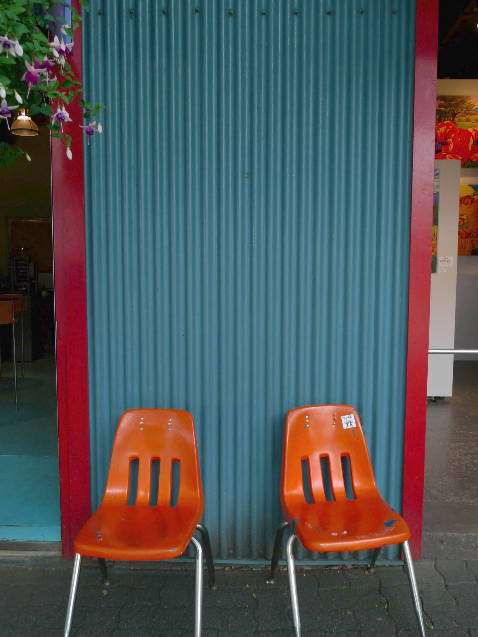 two orange chairs standing side by side