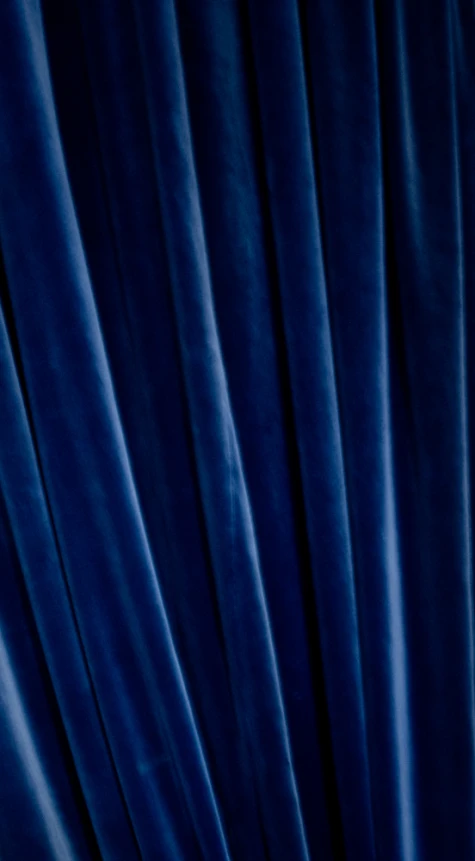 dark blue curtains on a window in a building