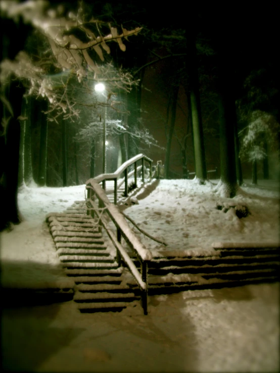 stairs and steps leading to a bright light in the night