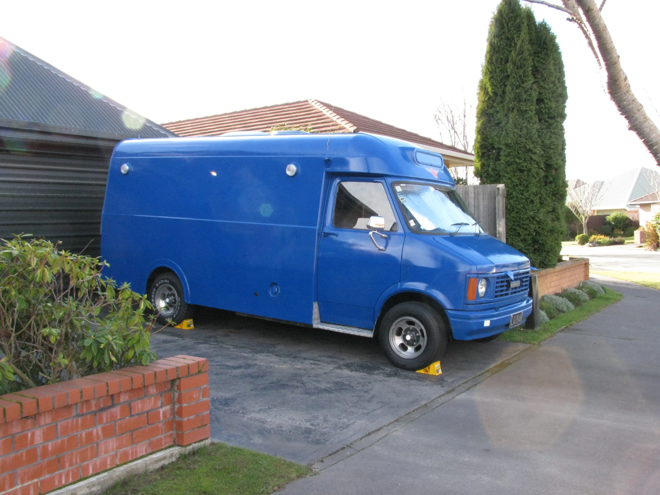 the large truck is parked in front of a home