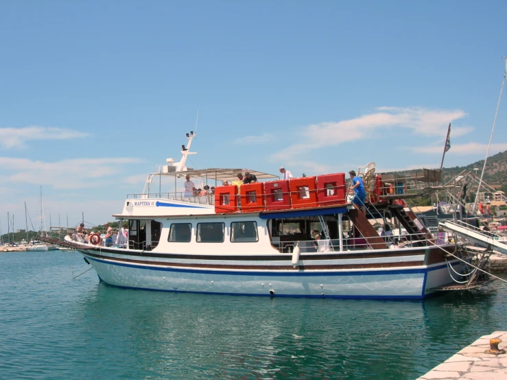 a boat is docked at a small island