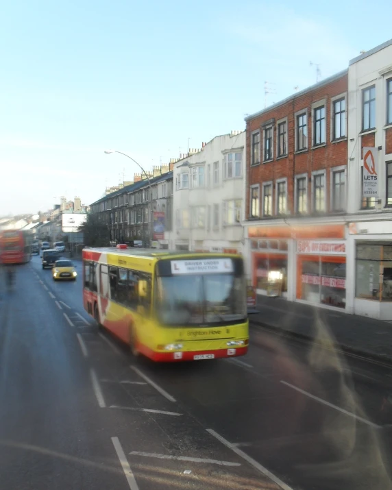 traffic moves along an empty street in a city