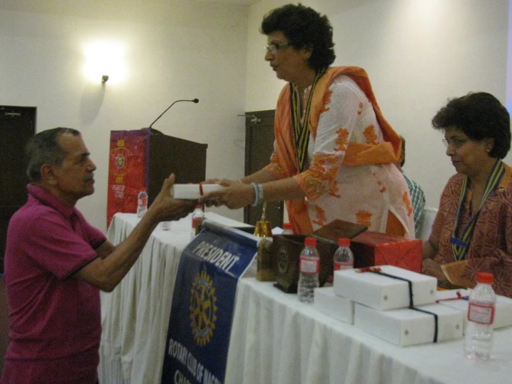 people in conversation at a political event