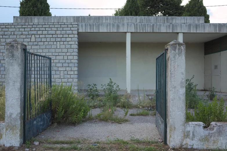 an old building with stone walls and two doors